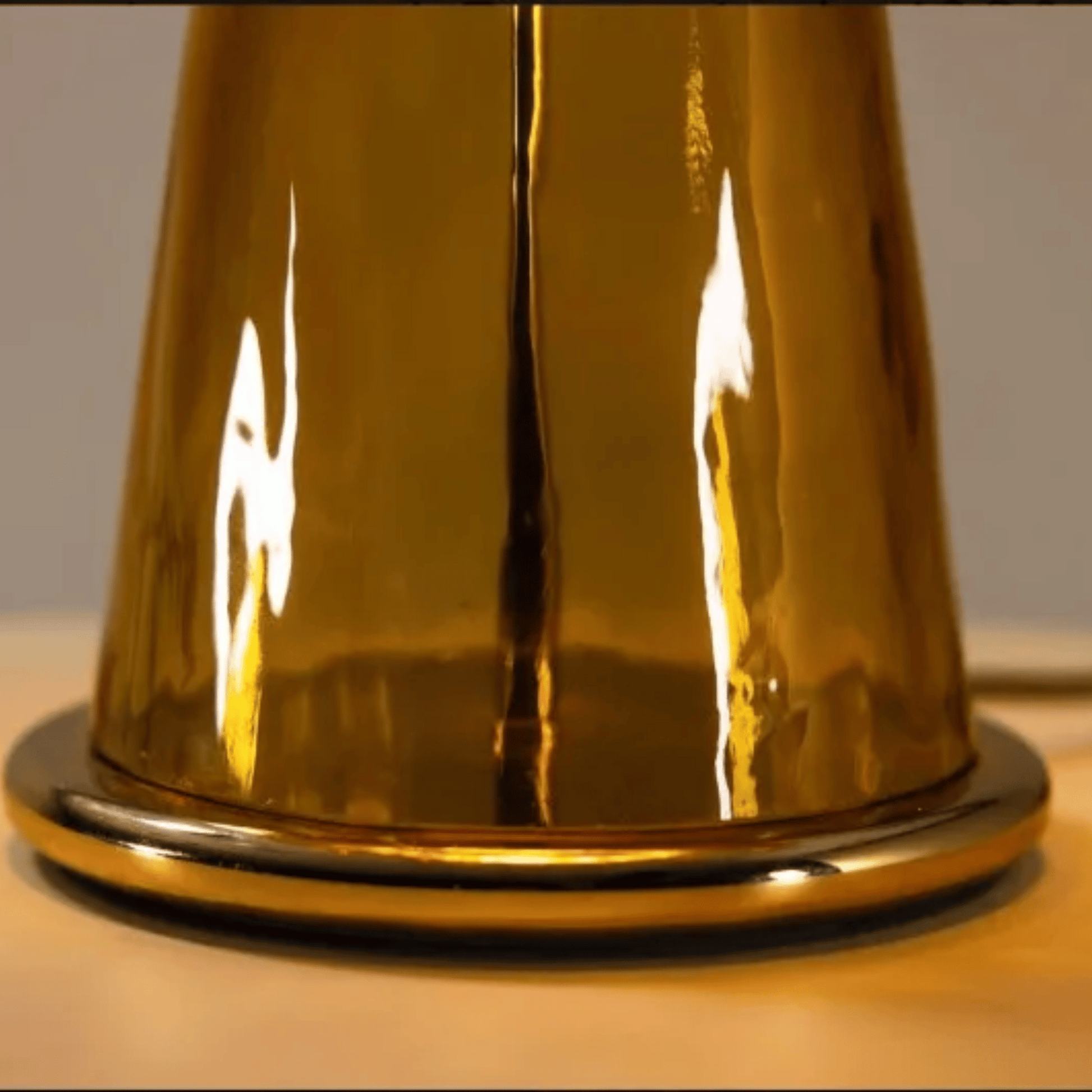 Gold metallic object on a neutral background
