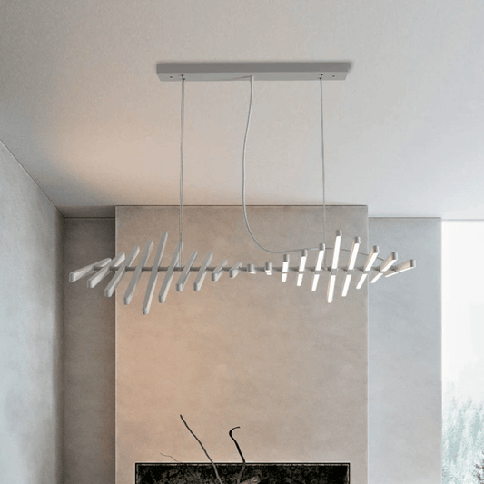 Modern pendant light fixture hanging in a room with neutral walls.