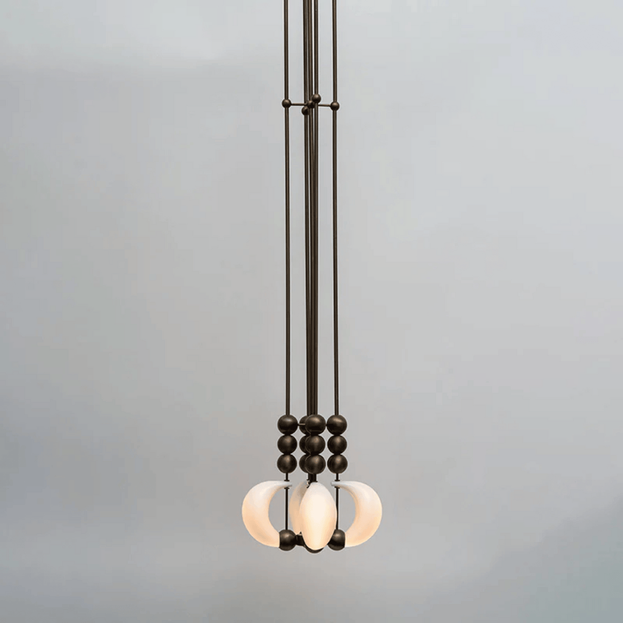 Modern pendant light with glass shades on a gray background