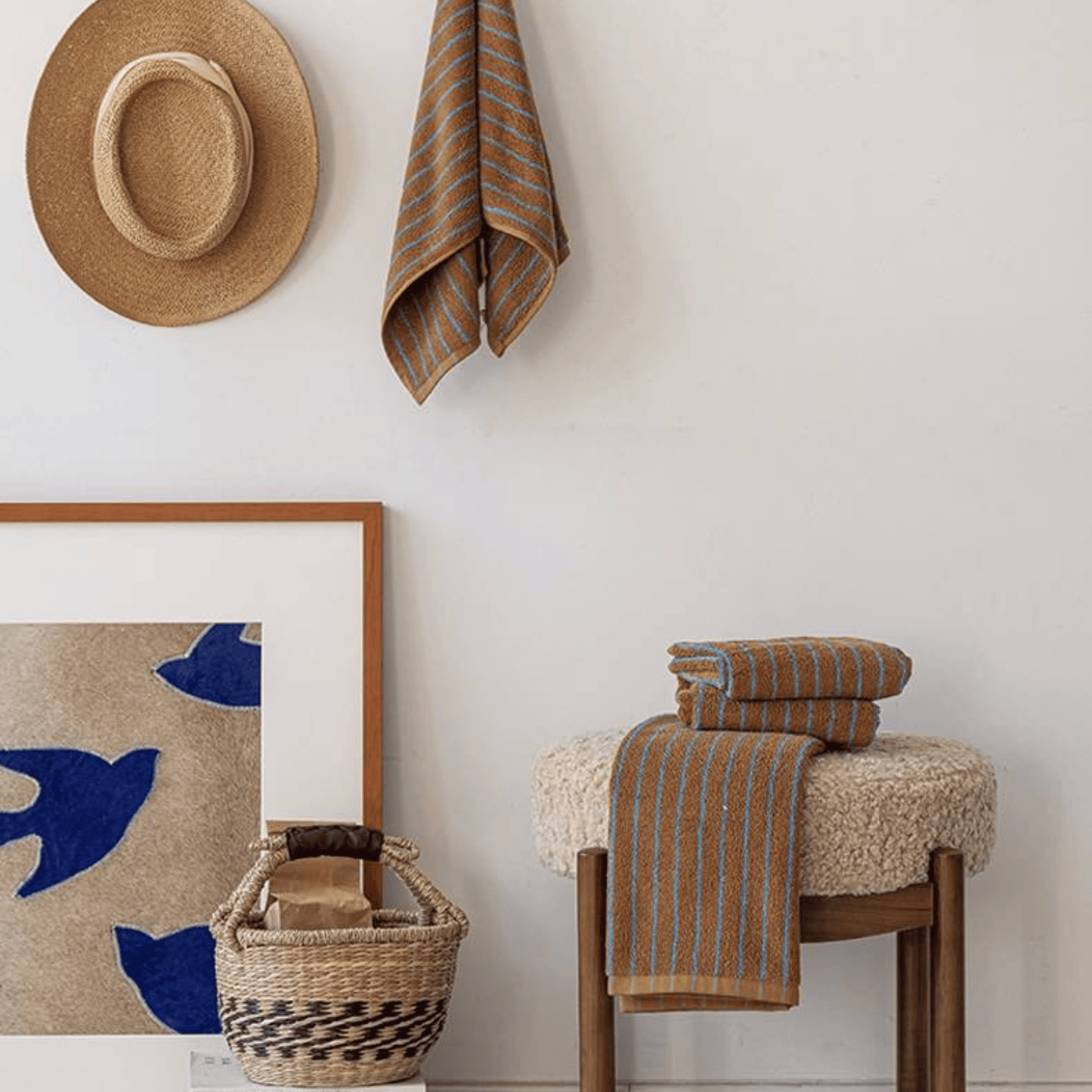 Room showing set of brown and turqiuoise towels