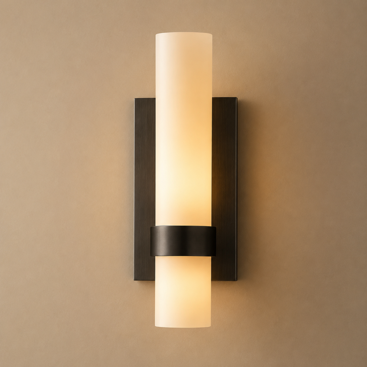 Wall-mounted light fixture with a cylindrical design on a beige wall.