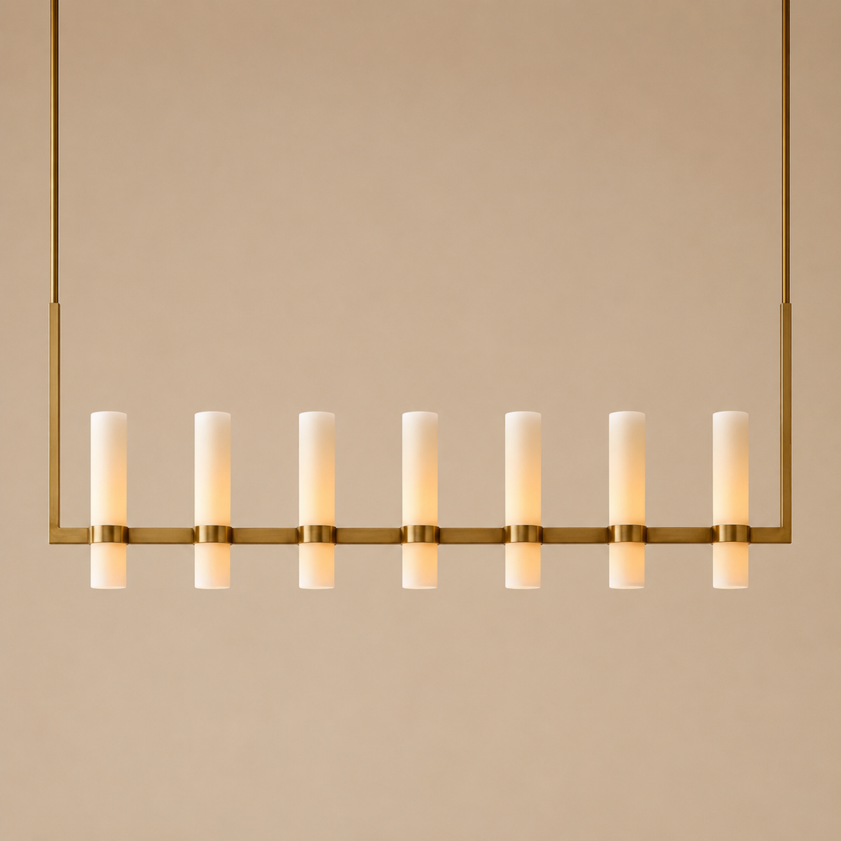 Modern chandelier with multiple cylindrical lights on a beige background