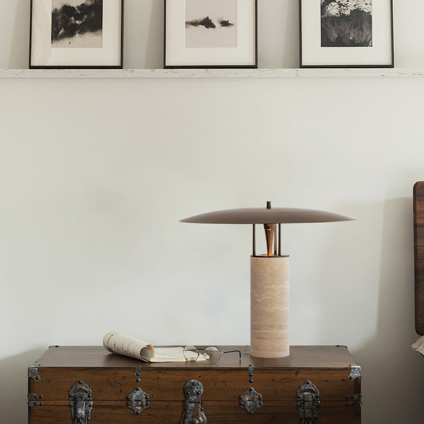 Contemporary dresser setup with a bamboo lamp and framed wall art in a neutral-toned room