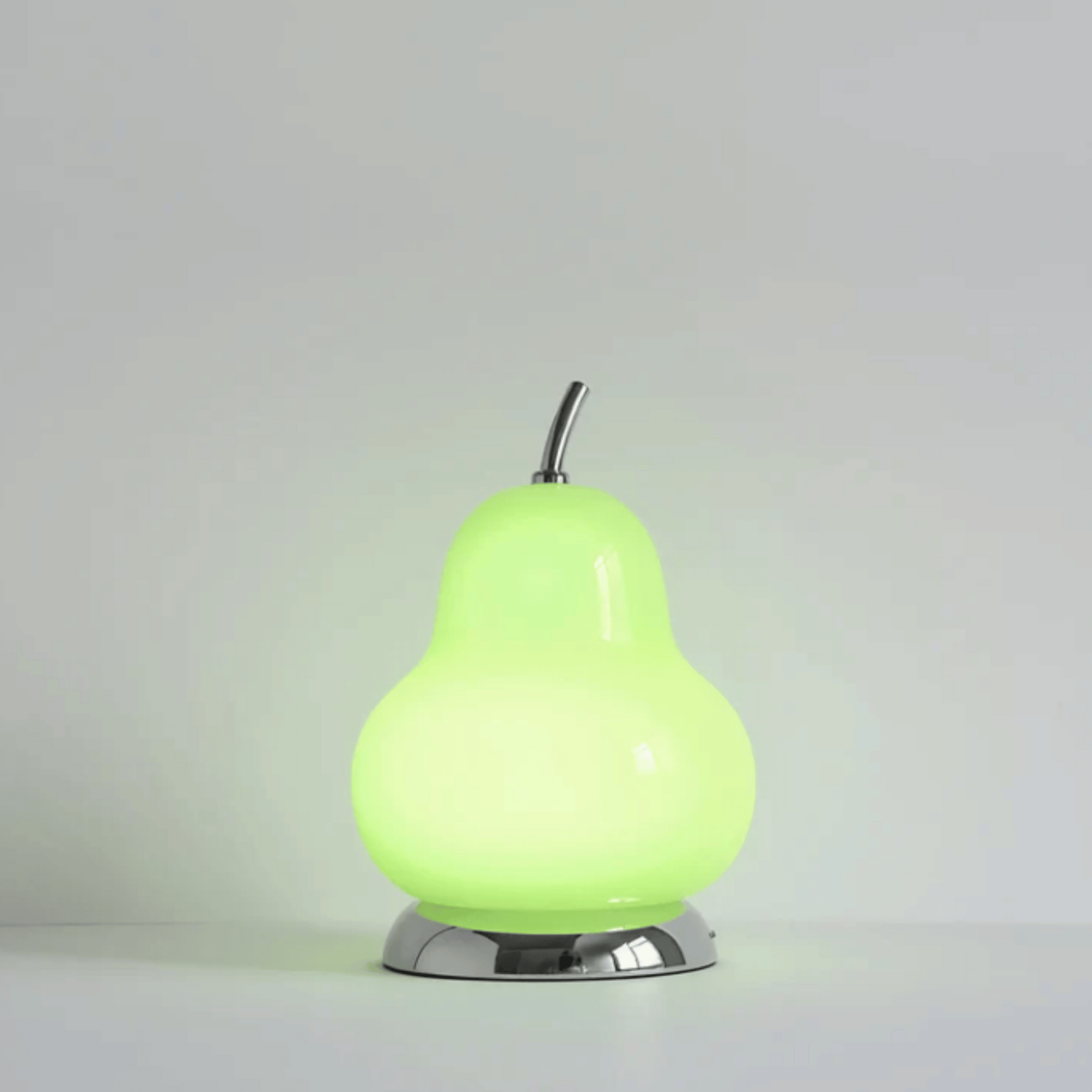 Green pear-shaped lamp on a gray background