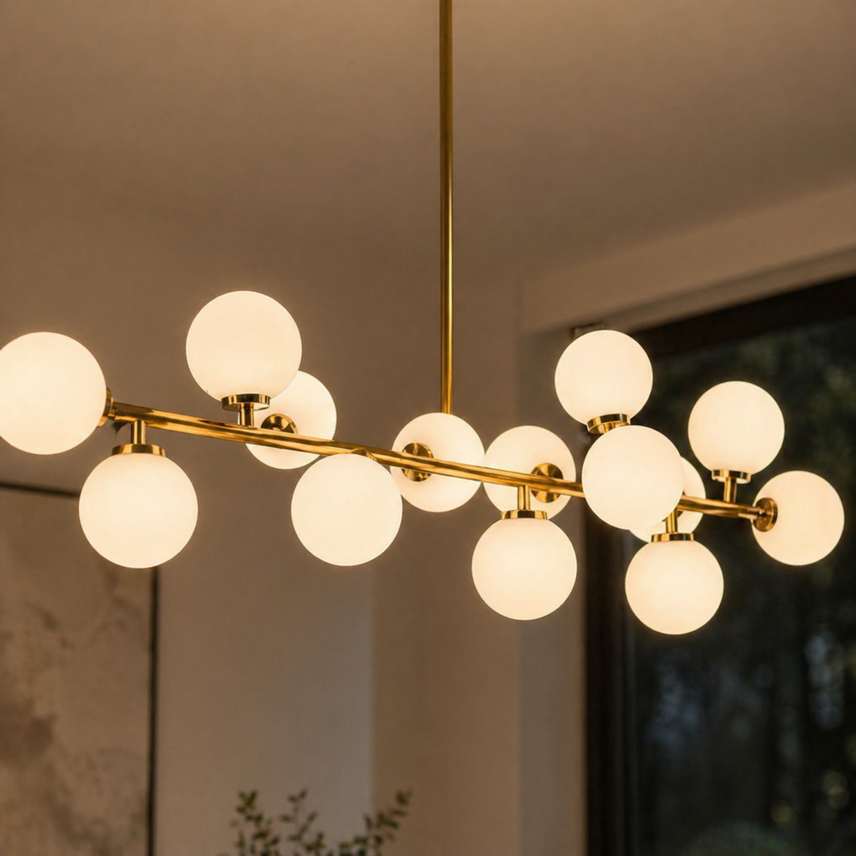 Modern chandelier with multiple round lights and gold fixtures against a neutral background.
