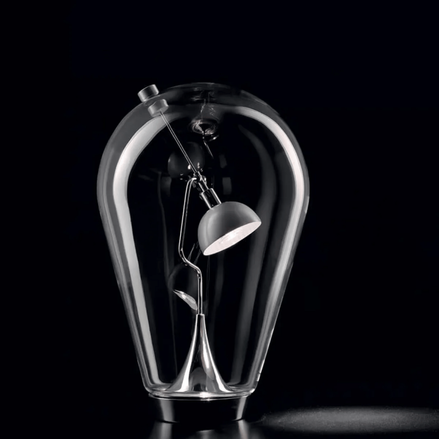 Glass bulb-shaped lamp with a smaller lamp inside on a black background