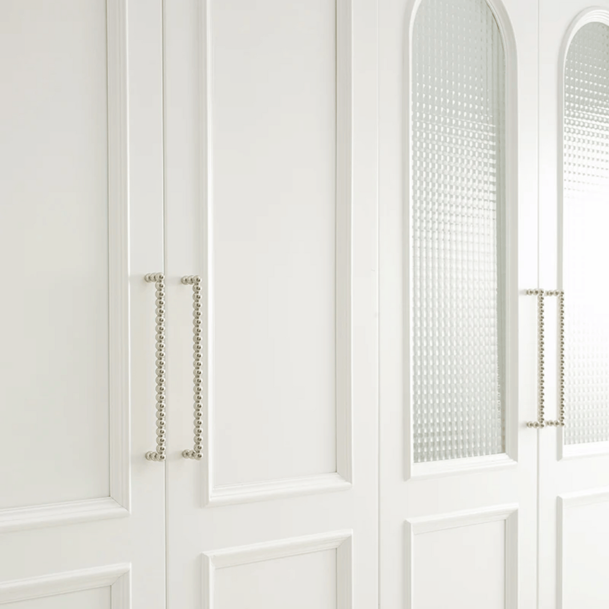 Close-up of a white cabinet with decorative elements