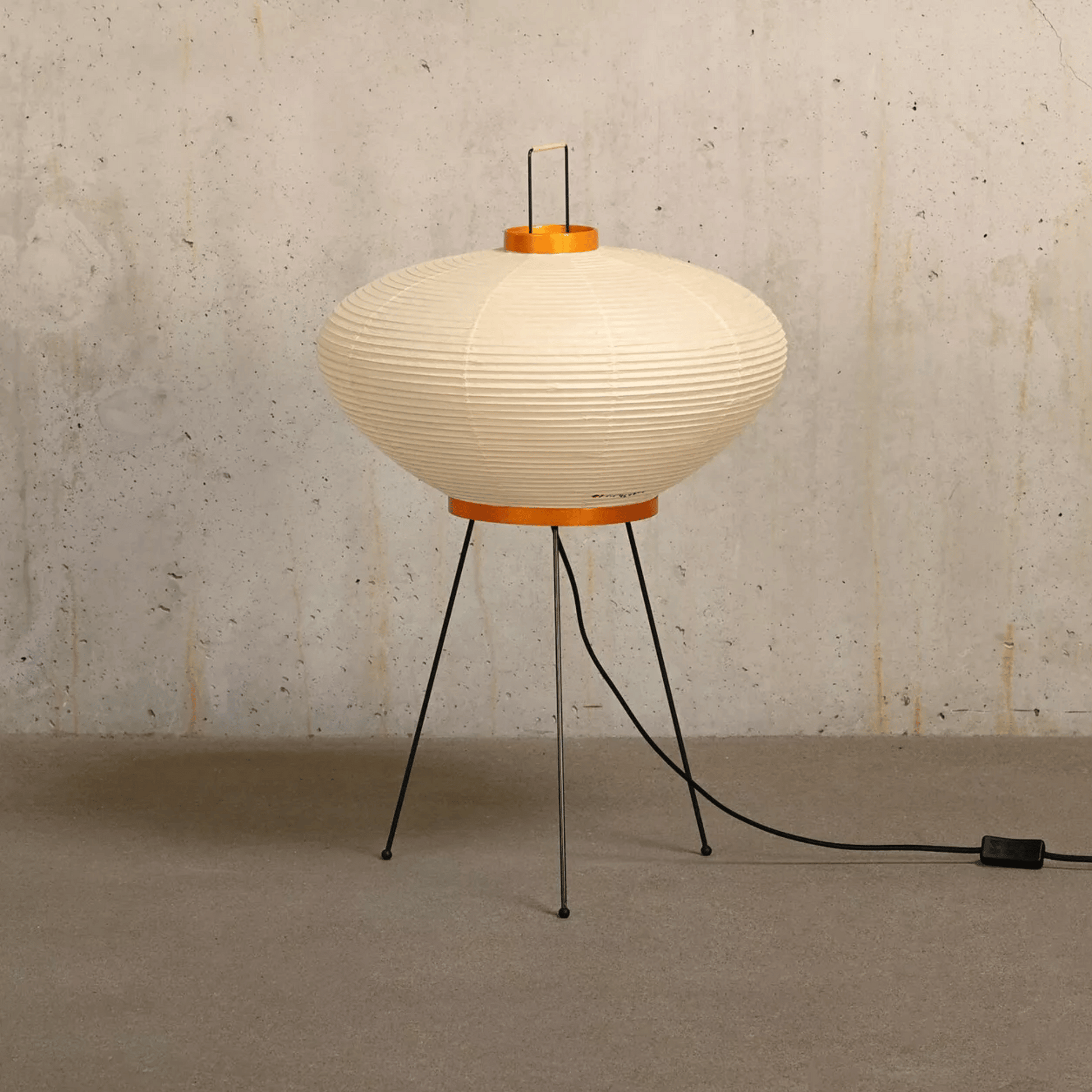 Modern floor lamp with ribbed design on a textured wall background