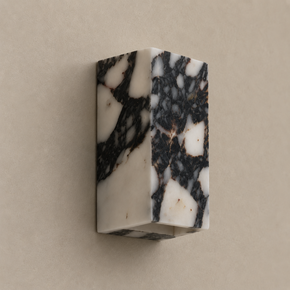Marble-patterned wall sconce on a beige background