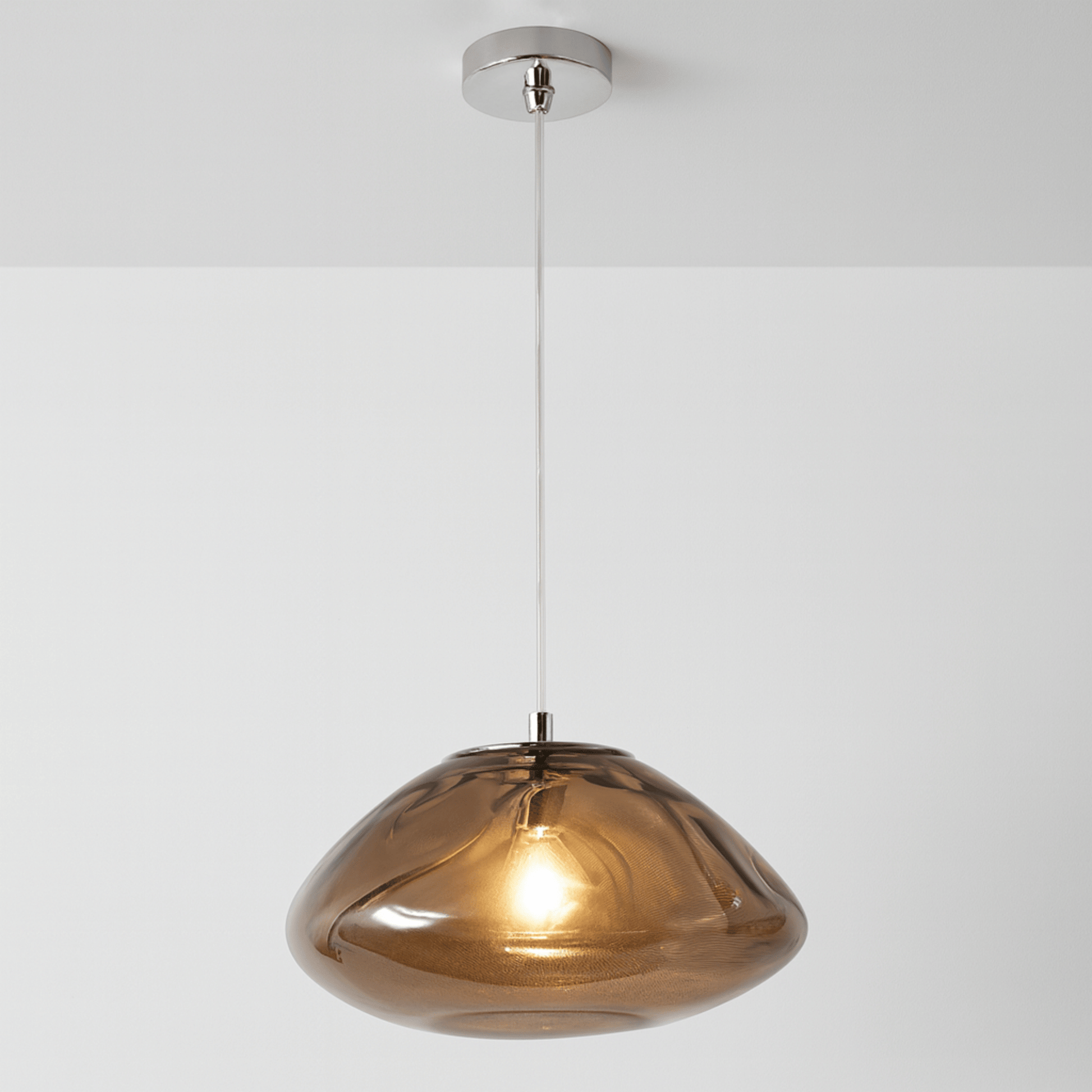Bronze pendant light on a white background