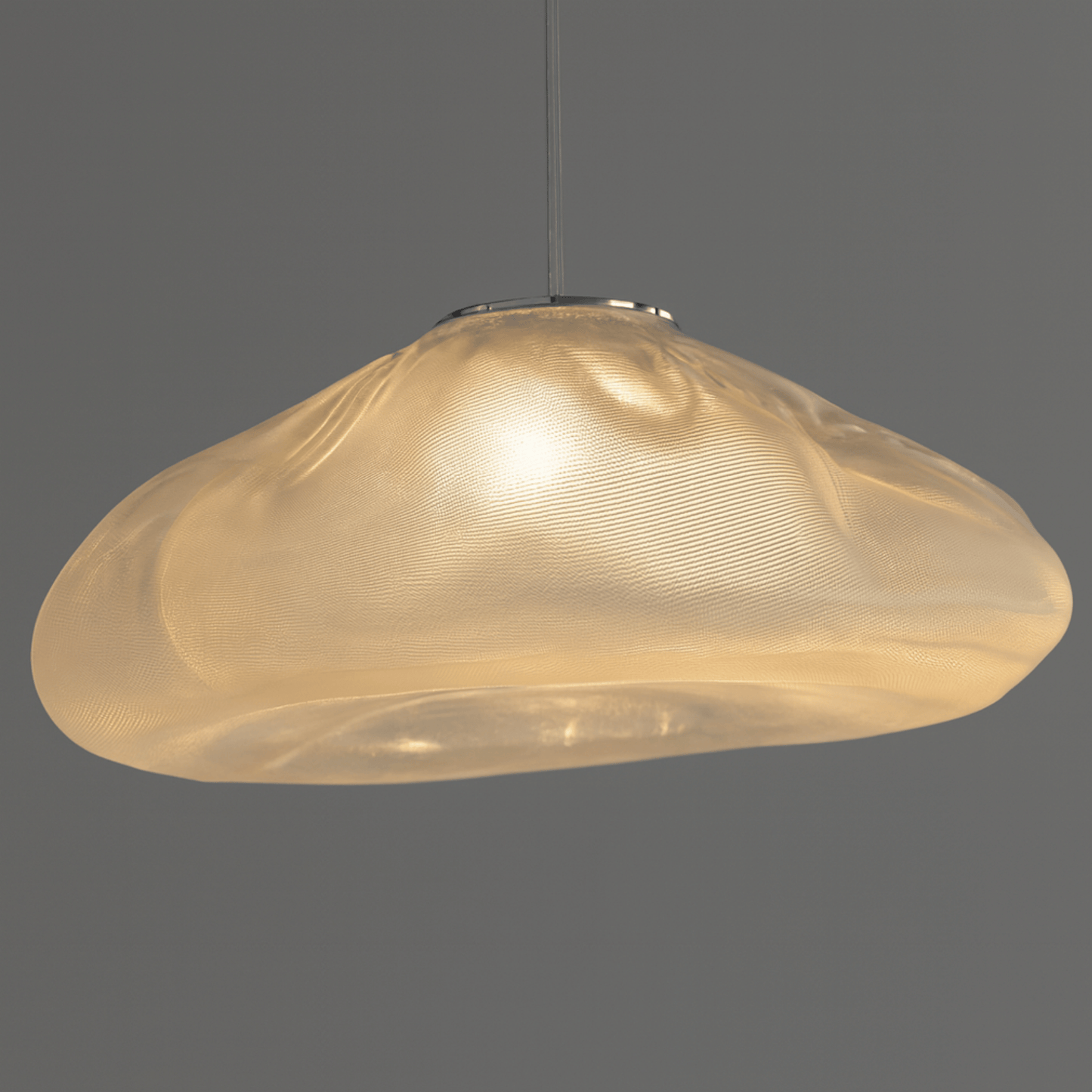 Gold pendant light on a dark gray background