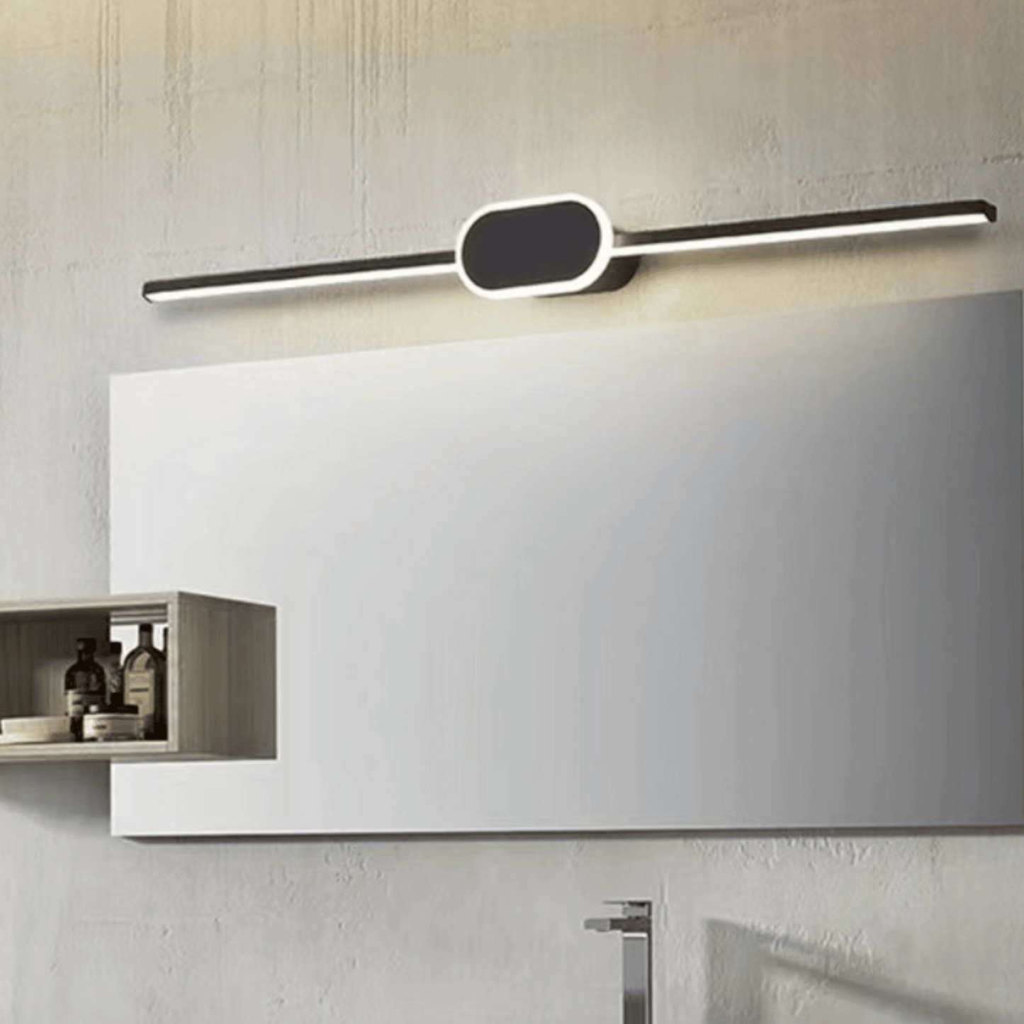 Modern wall-mounted light fixture above a mirror in a bathroom setting.