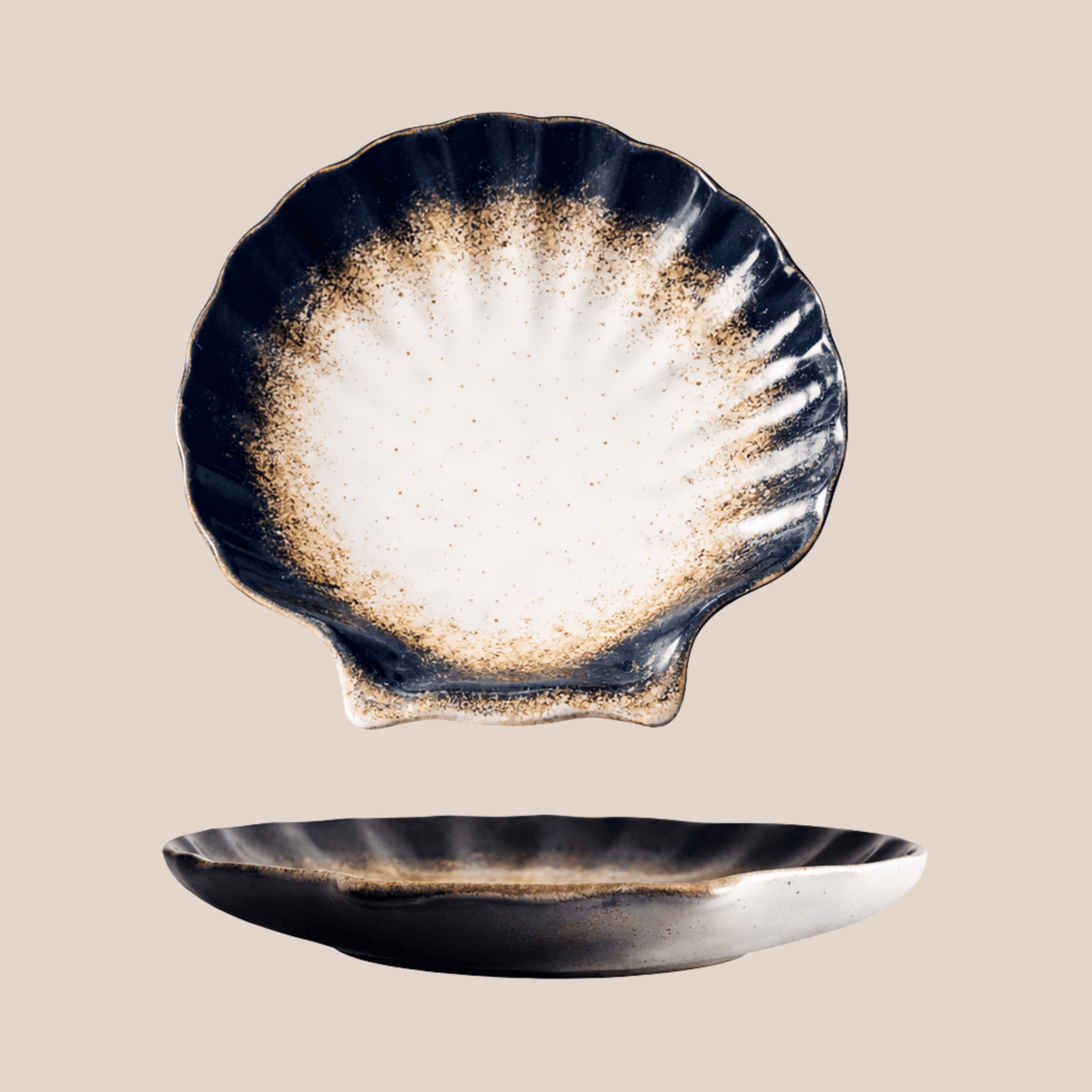 Ceramic shell-shaped dish with a textured surface on a beige background