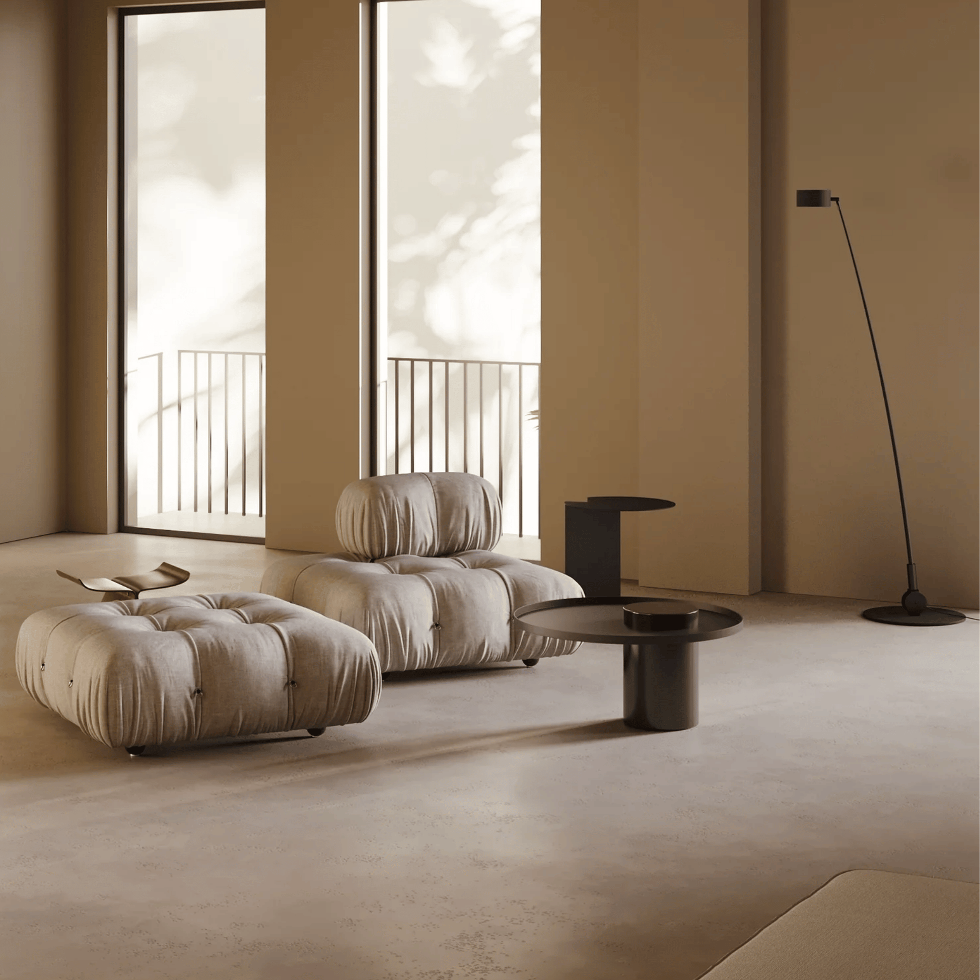 Modern living room with beige sofa, ottoman, and coffee table in a minimalistic setting.