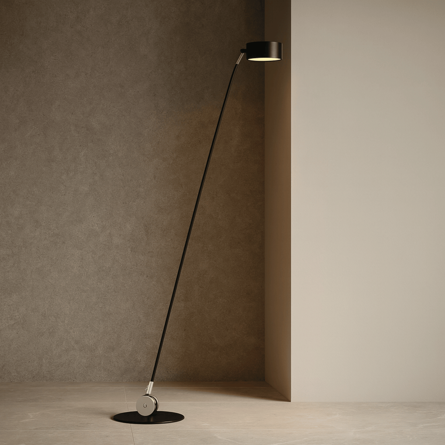 Modern floor lamp with long black cable against a neutral wall.