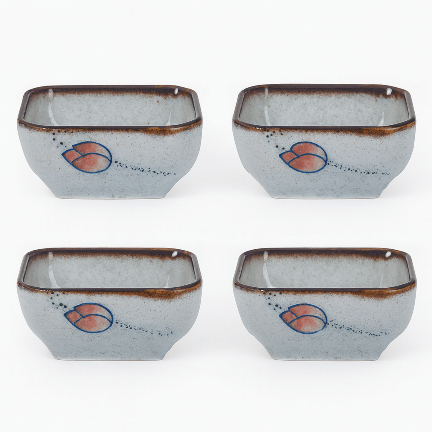 Four ceramic bowls with a decorative design on a white background