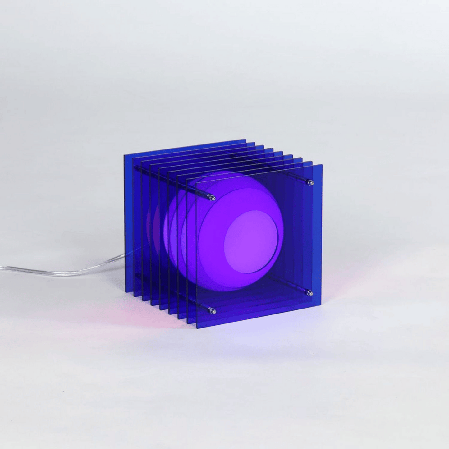 Blue and purple geometric light fixture on a white background