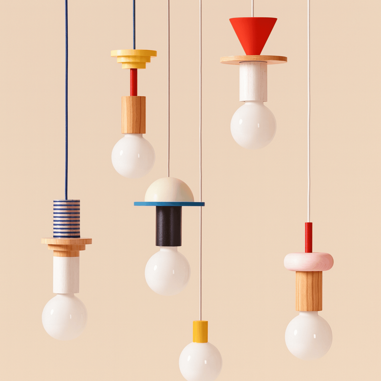 Colorful pendant lights with geometric designs on a beige background