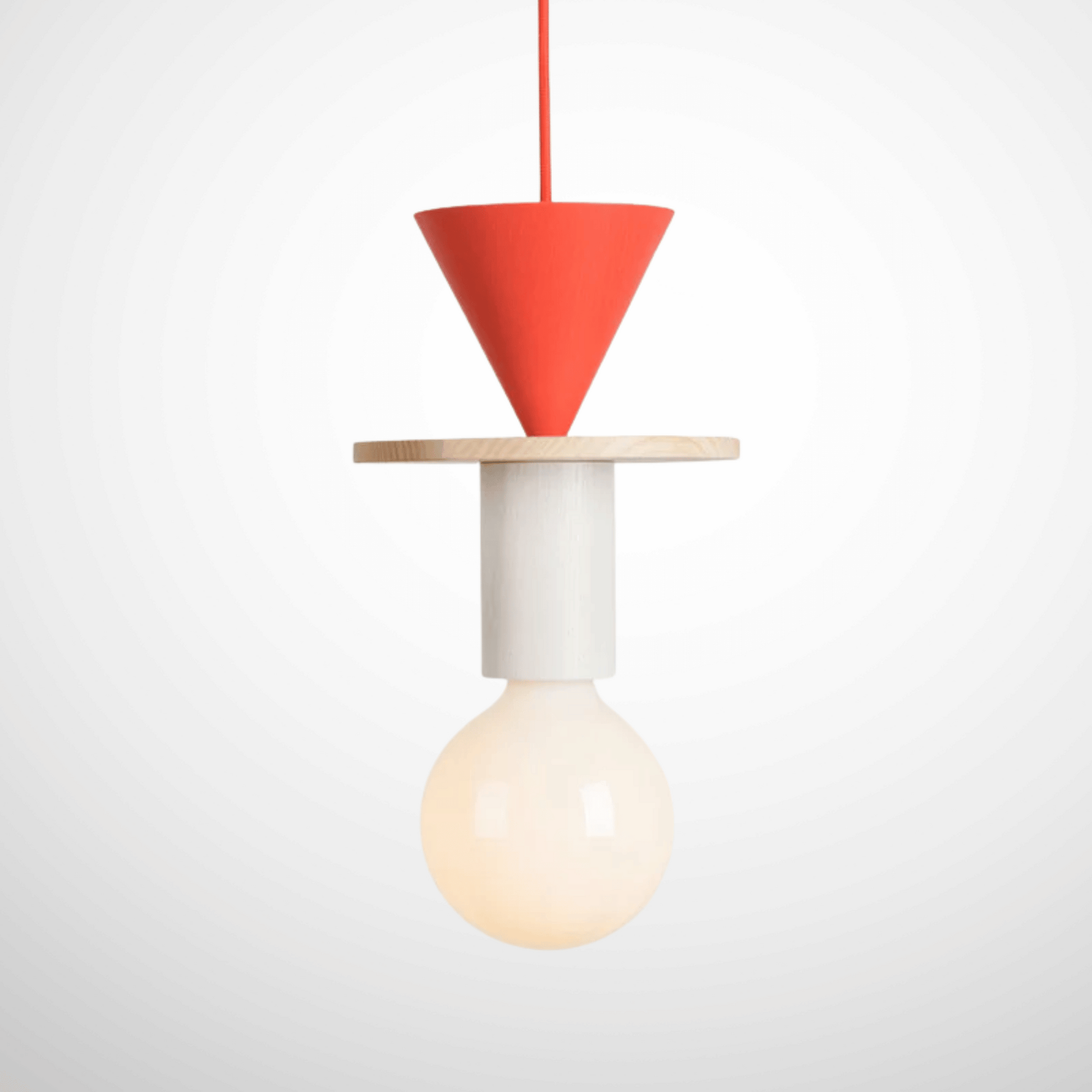 Modern pendant light with red cone shade and white base on a white background