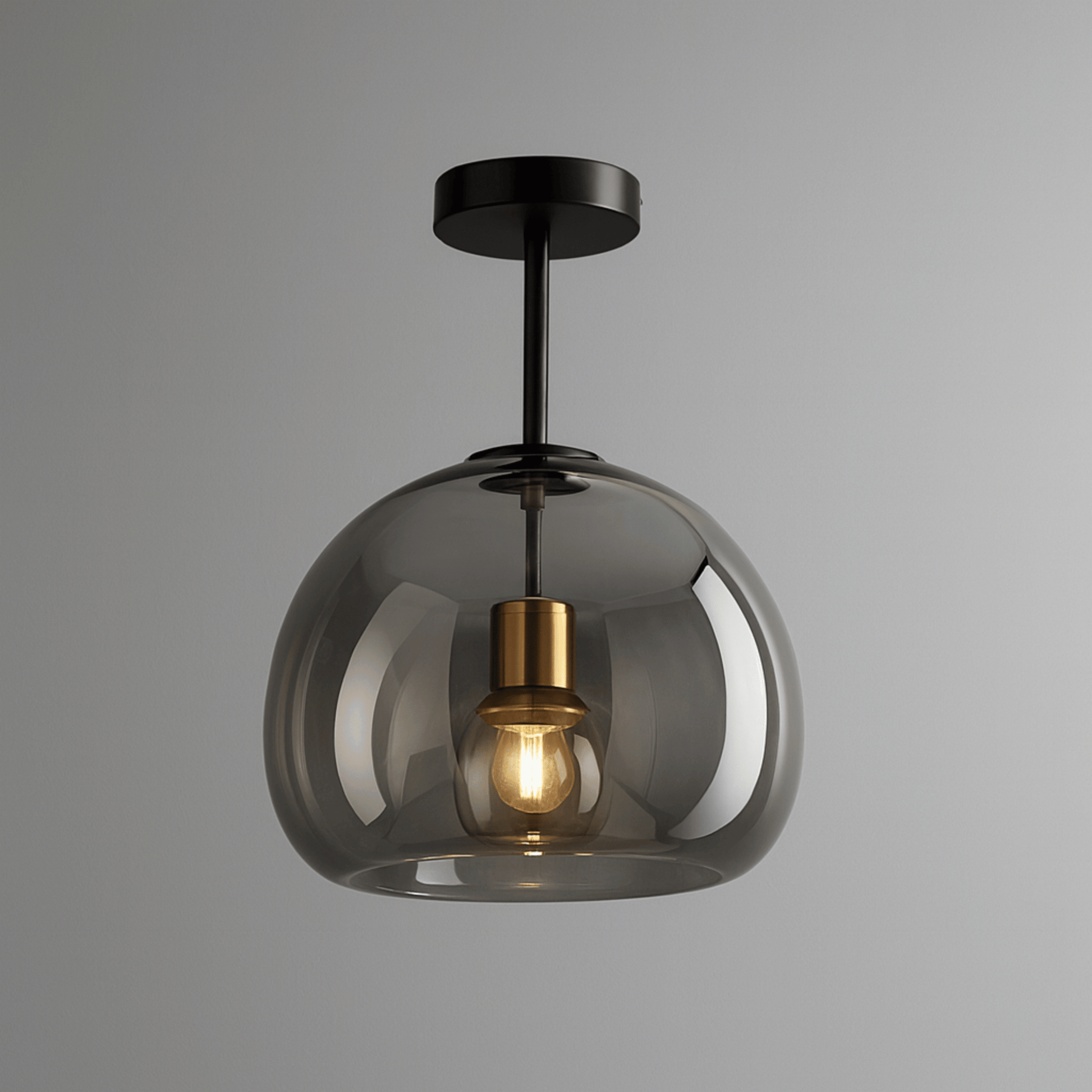 Modern ceiling light fixture with smoked glass shade and gold interior on a gray background