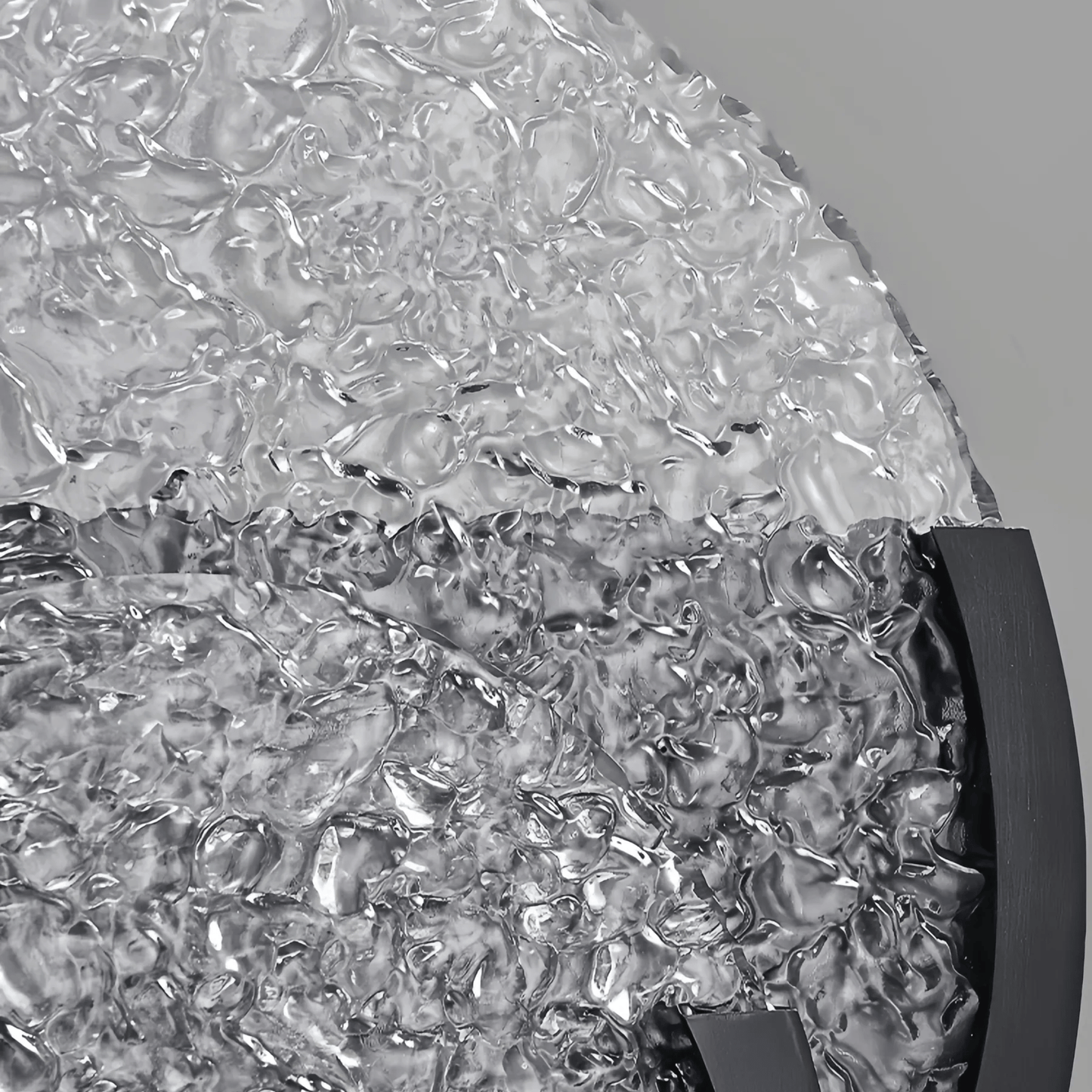 Close-up of textured glass surface with a gray background