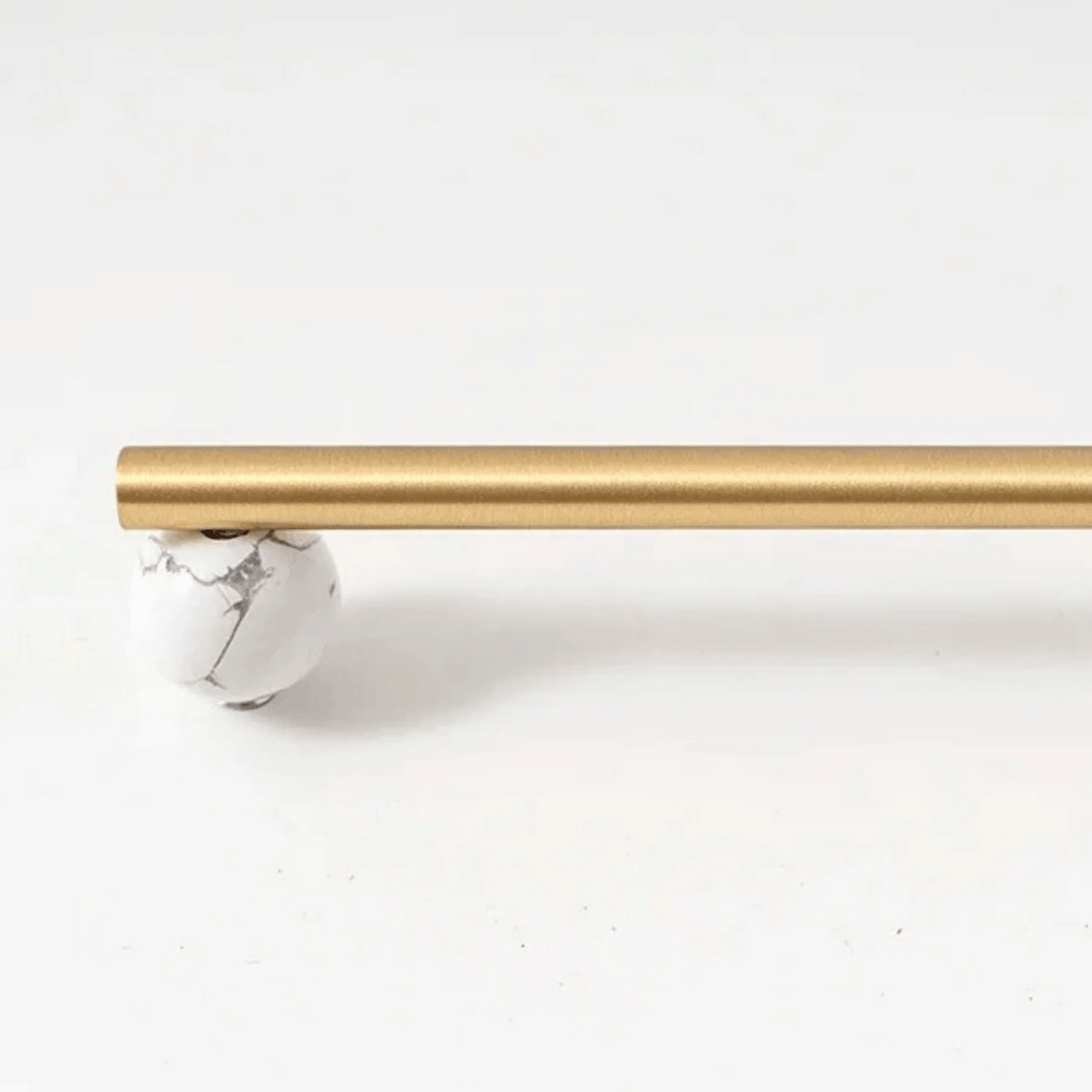 Gold curtain rod on a white background