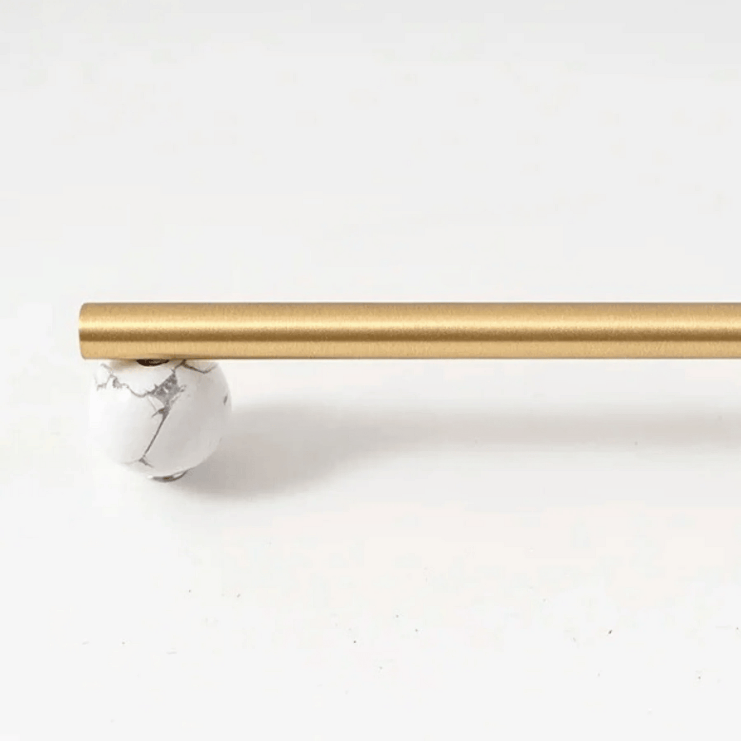 Gold curtain rod on a white background