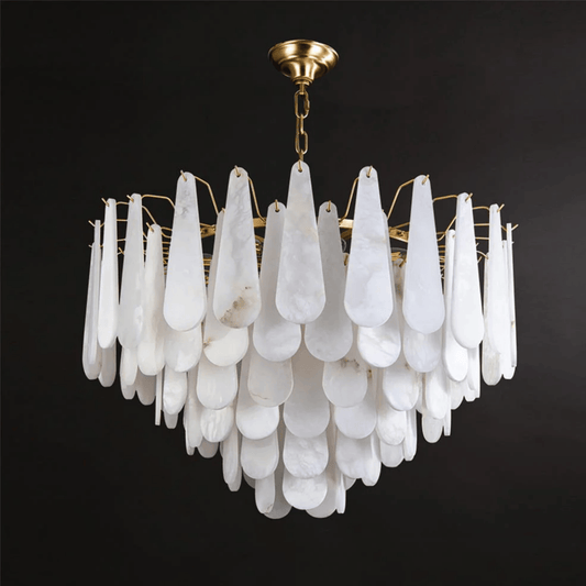 Chandelier with white teardrop-shaped glass and gold fixture on a black background