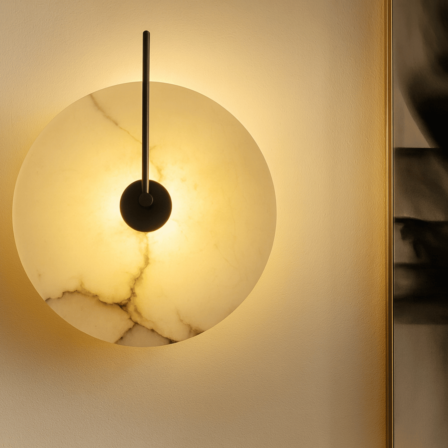 Round wall light fixture with marble texture on a neutral wall.