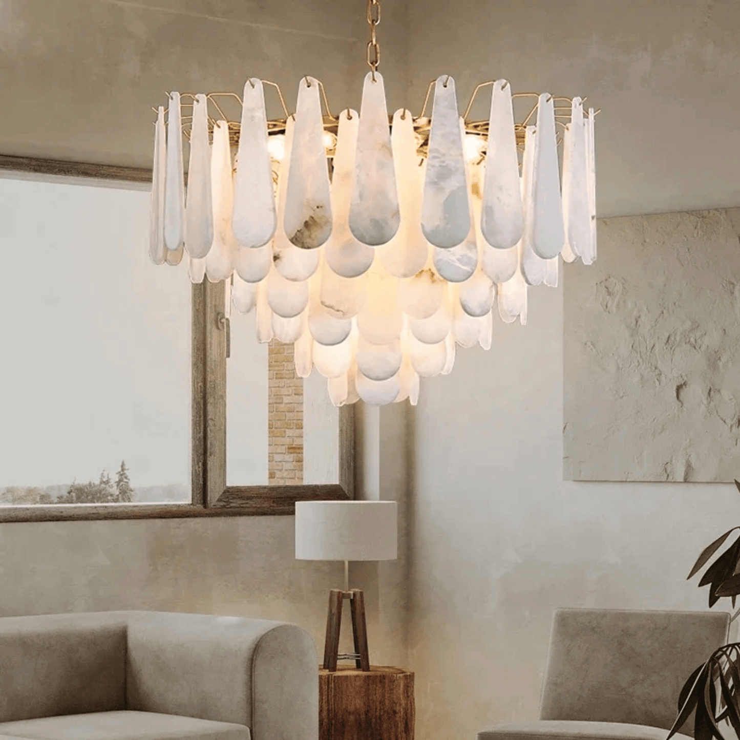 Modern chandelier with white glass shades in a living room setting.