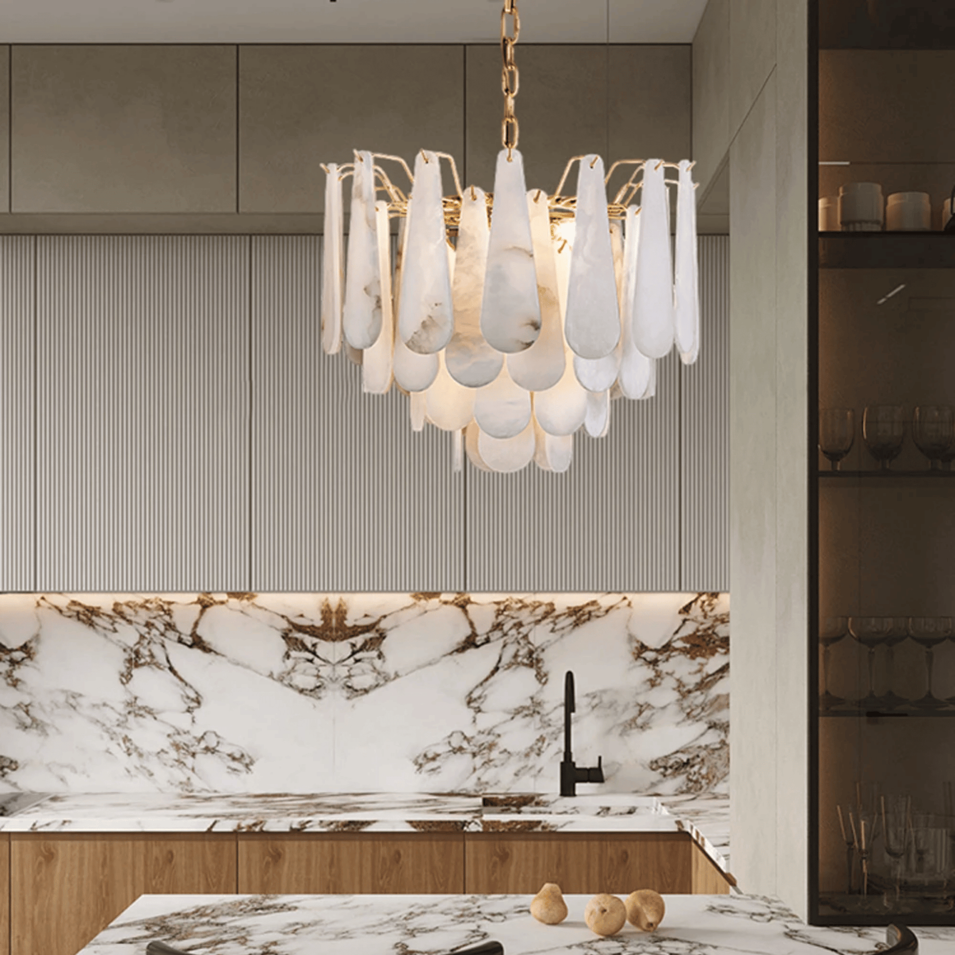 Modern kitchen with a chandelier and marble countertop
