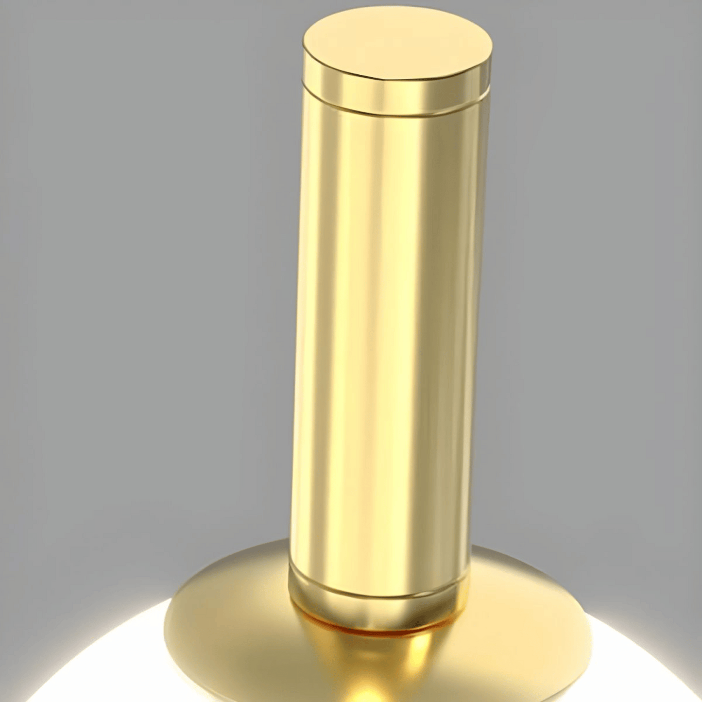 Gold cylindrical object on a gray background