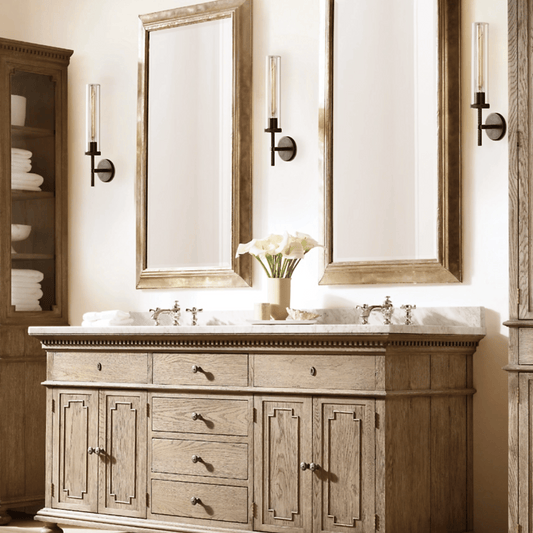 Bathroom vanity with double sink, mirrors, and decorative elements.