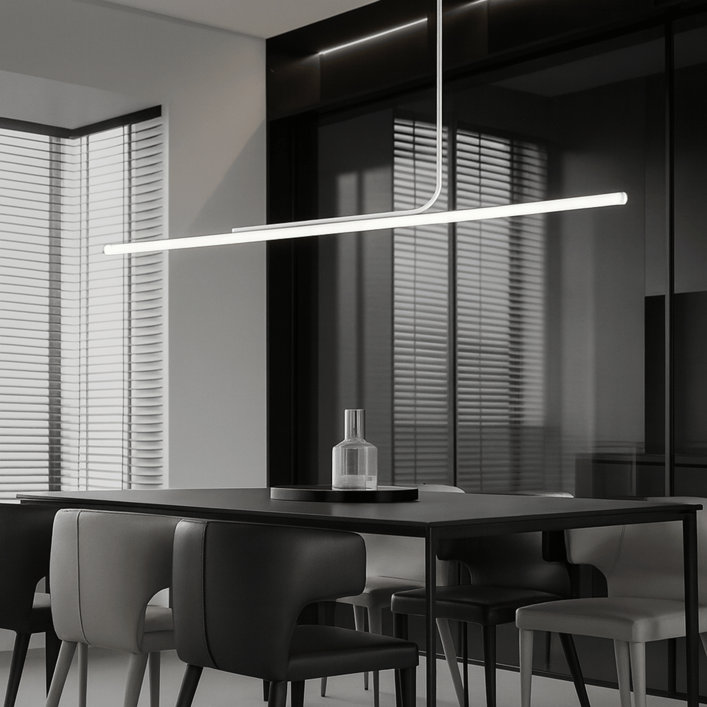 Modern dining room with a long linear pendant light fixture.