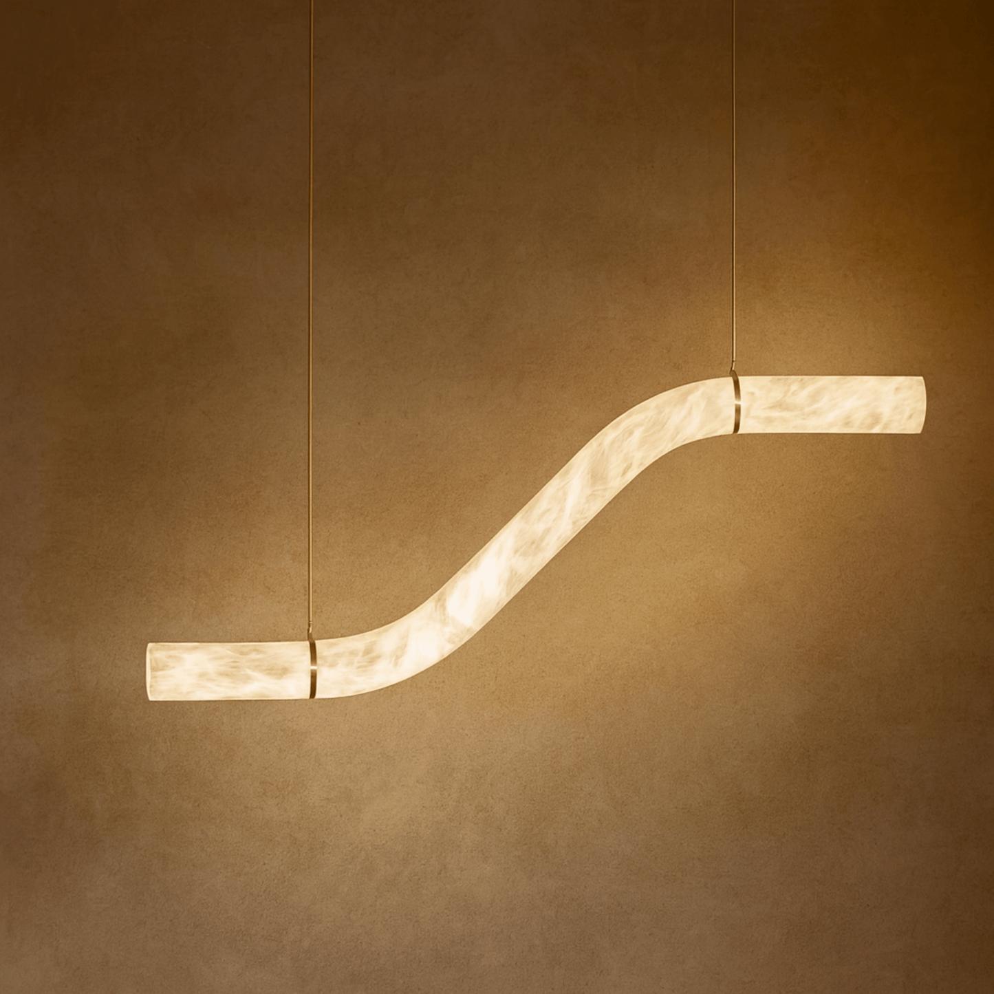 Modern pendant light with a curved design on a brown background