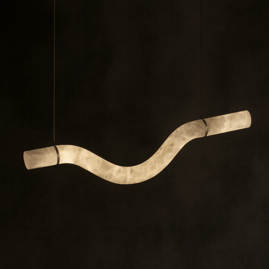 Sculptural light fixture with wavy design on a black background