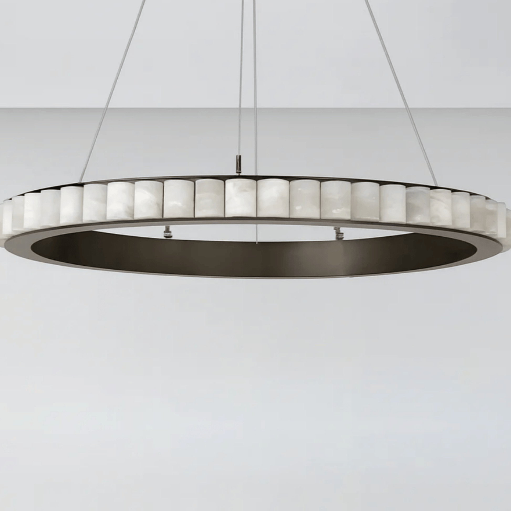 Modern pendant light with circular design on a white background