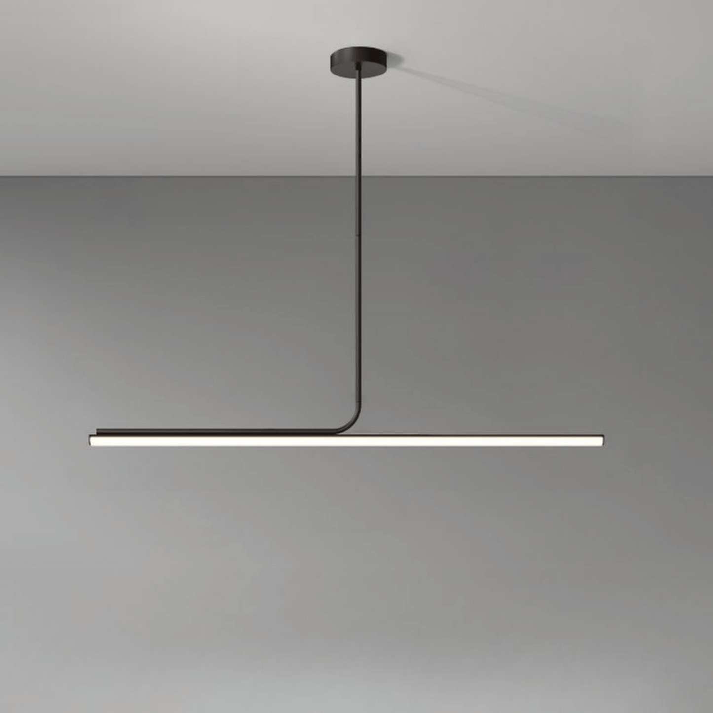 Modern pendant light with a black finish on a gray background