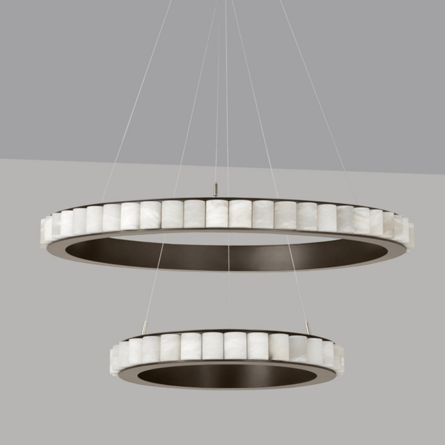 Modern pendant light with circular design on a gray background