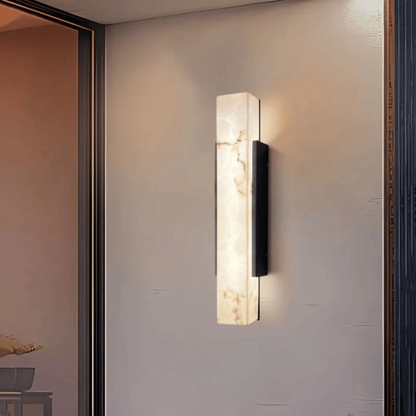 Modern wall sconce on a neutral wall with a soft glow