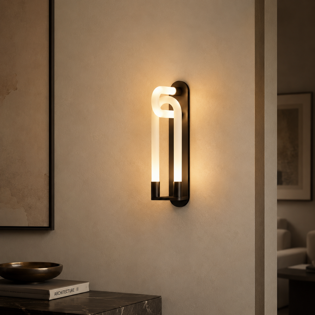 Modern wall sconce on a neutral wall with a soft glow