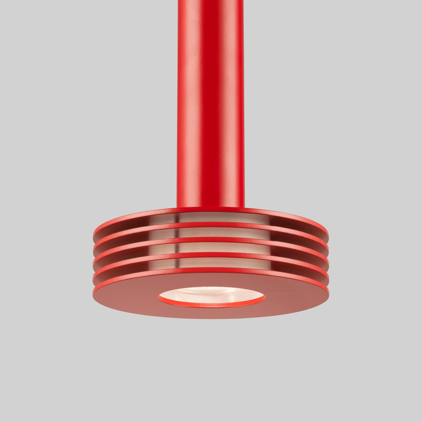 Red pendant light fixture on a gray background