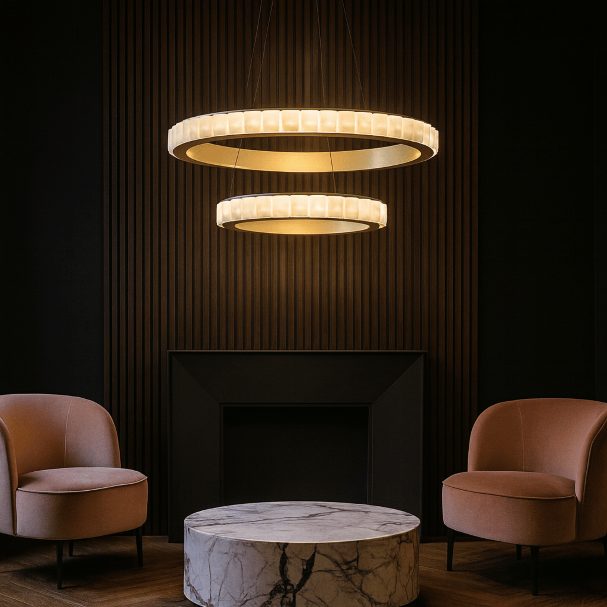Modern chandelier hanging above a marble table with two armchairs in a dimly lit room.
