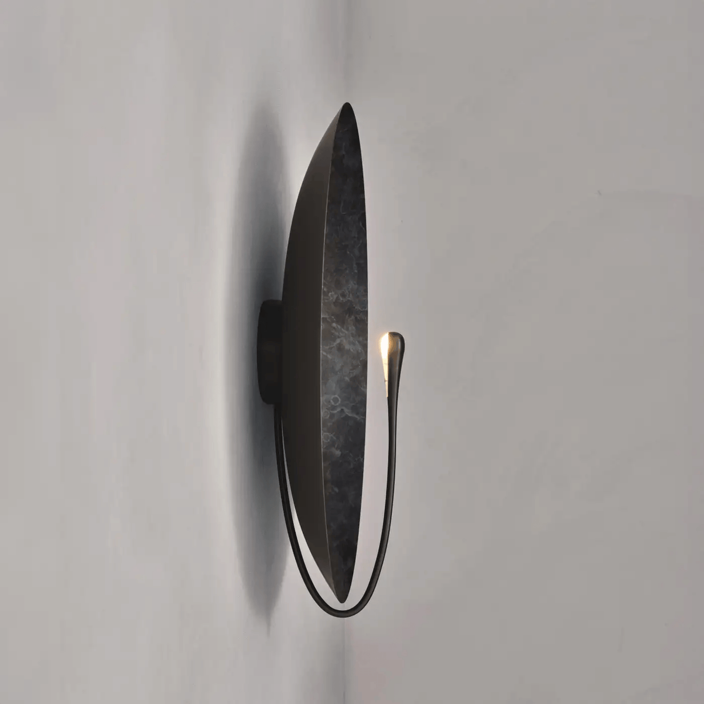 Modern wall light fixture on a plain white background