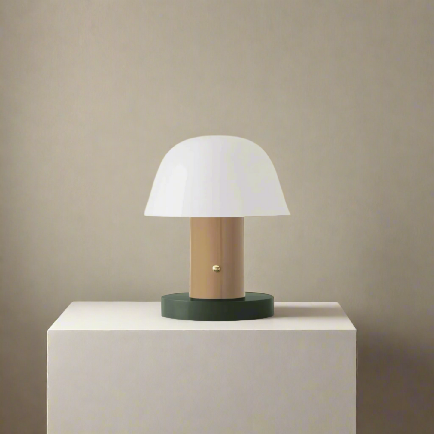 Small table lamp with a white shade and wooden base on a beige background