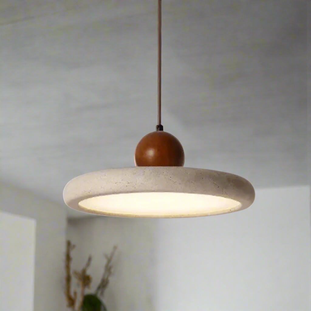 Pendant light with concrete shade and wooden bulb holder on a gray background