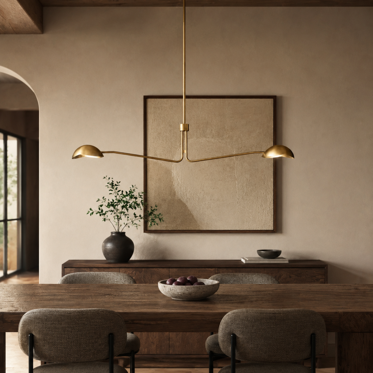 Modern dining room with a long wooden table, chairs, and a pendant light fixture.