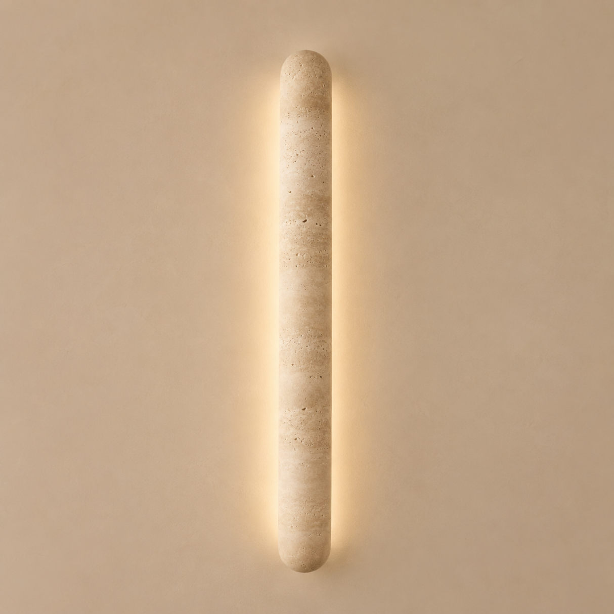 Cylindrical wall light fixture on a beige wall
