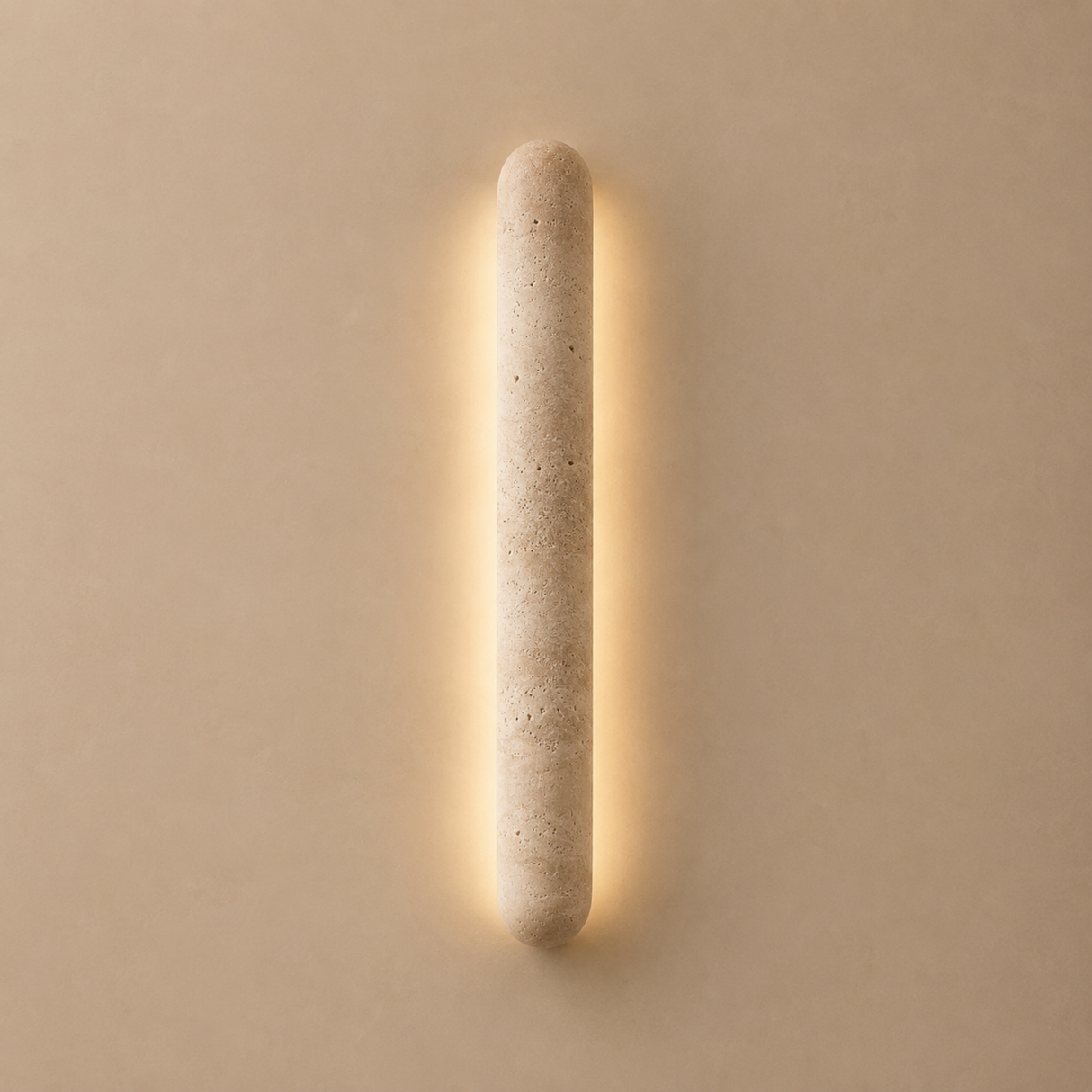 Cylindrical wall light fixture on a beige wall