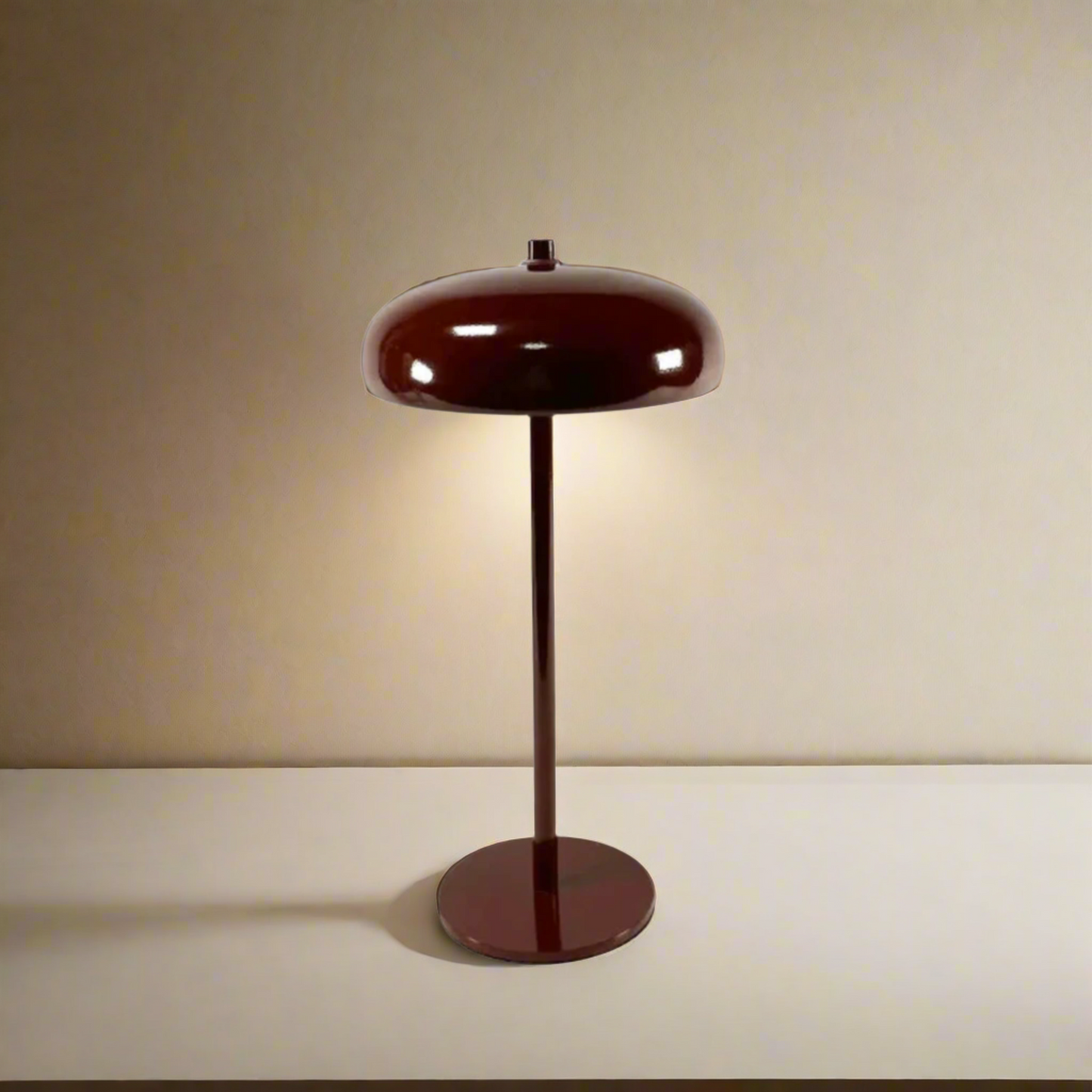 Brown floor lamp with a round base and two layered shade on a white background